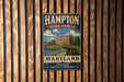 A vintage metal sign for the Hampton National Historic Site in Maryland, featuring an illustration of a historic building and a cannon.