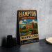 A vintage metal sign for the Hampton National Historic Site in Maryland, featuring an illustration of a historic building and a cannon.