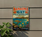 A vintage metal sign for Hanauqua Bay, Hawaii, featuring a turtle, fish, and coral reef, mounted on a wall next to a plant.