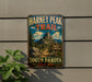 A vintage metal sign for the Harney Peak Trail in South Dakota, featuring a scenic mountain landscape with a trail and directional signs.