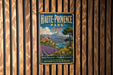 A vintage metal sign for Haute-Provence Park in France, featuring a scenic landscape with mountains, fields, and a river.