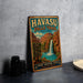 A vintage-style metal sign for Havasu Falls Trail in Arizona, featuring a waterfall and desert landscape.