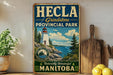 a vintage-style sign for the town of Hecla, located in the Grindstone Provincial Park in Manitoba, Canada.