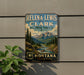 A vintage-style sign for Helena-Lewis and Clark National Forest in Montana, featuring a scenic mountain landscape with a river and pine trees.