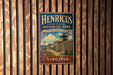 A vintage-style metal sign for Henricus Historical Park in Virginia, featuring a historical illustration of a fort and surrounding landscape.