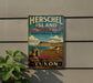 A vintage-style metal sign for Herschel Island, Qikiqtaruk, and Territorial Park, with a scenic landscape featuring mountains, a beach, and colorful flowers.