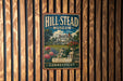 A vintage metal sign for the Hill-Stead Museum in Connecticut, featuring an illustration of a house surrounded by flowers and greenery.