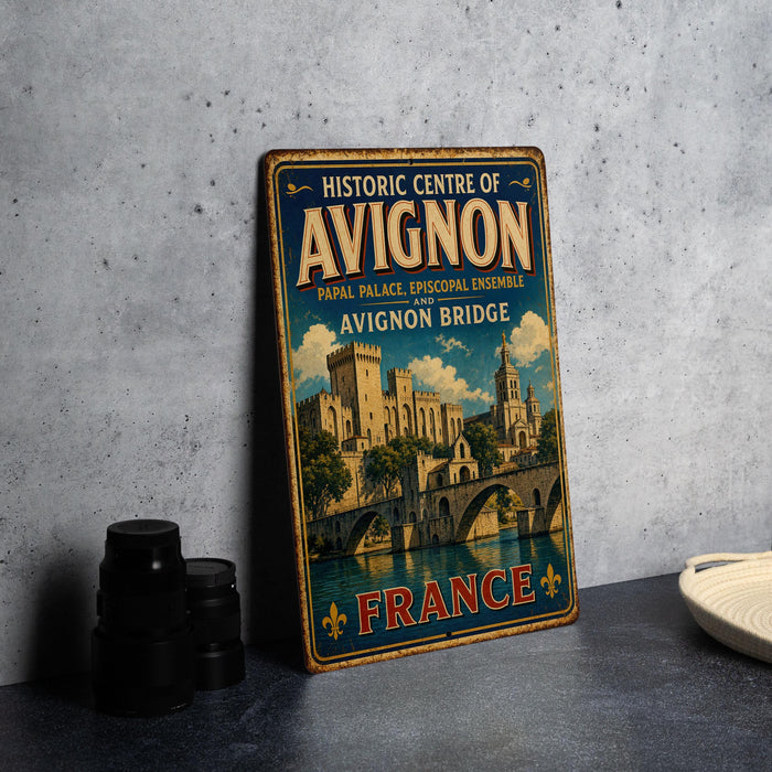 A vintage-style metal sign for the Historic Centre of Avignon, France, featuring an illustration of the Avignon Bridge and the city's architecture.