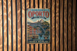 A vintage-style metal sign for the Historic Centre of Oporto, Portugal, featuring an illustration of the Luiz I Bridge.