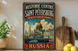 A vintage-style sign for the Historic Centre of Saint Petersburg, Russia, featuring an illustration of the city's landmarks and architecture.