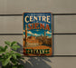 A vintage-style metal sign with the text "HISTORIC CENTRE of SIENA ITALY" and an illustration of a cityscape, mounted on a wall.
