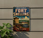 A vintage-style sign for the historic Fort Snelling in Minnesota, featuring a castle, cannon, and American flag.