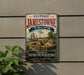 A vintage-style metal sign for Historic Jamestown, Virginia, featuring an illustration of a ship and a fort, mounted on a wall.