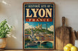 A vintage-style metal sign with the text "HISTORIC SITE OF LYON FRANCE" and an illustration of a cityscape with a river and a bridge.