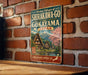 A vintage-style sign for the historic villages of Shirakawa-go andokaya in Japan, featuring a scenic image of traditional Japanese houses and a mountain backdrop.