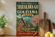 a vintage-style sign advertising the historic villages of Shirakawa-Go and Kokayama, Japan, with a scenic illustration of traditional Japanese houses and a mountain backdrop.