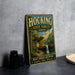 A vintage-style sign for Hocking State Forest, Ohio, featuring a scenic image of a waterfall and forest.
