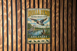A vintage metal sign for the Hollabend National Wildlife Refuge in Arkansas, featuring a bird illustration and text promoting conservation and protection.