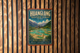 A vintage-style metal sign for the Huanglong Biosphere Reserve in China, featuring a scenic landscape with mountains, waterfalls, and a temple.