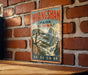 A vintage-style metal sign with the text "HUANGSHAN PARK CHINA" is displayed on a brick wall.