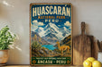 A vintage-style poster for Huascaran National Park in Peru, featuring a mountain landscape with a llama and text promoting the protection of the park's natural heritage.