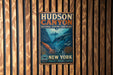 A vintage metal sign for Hudson Canyon National Marine Sanctuary, featuring an illustration of underwater marine life and the text "Hudson Canyon National Marine Sanctuary" and "New York".