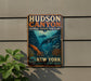 A vintage-style metal sign for Hudson Canyon National Marine Sanctuary, featuring an illustration of marine life and the text "New York" and "Protect & Explore - Inspire".