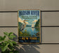 A vintage-style metal sign for the Hudson River National Estuarine Research Reserve in New York, featuring a heron and a sailboat on the water.