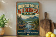 a vintage-style metal sign advertising Maine's wilderness, with a moose and a river in the background.