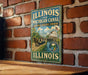 A vintage-style sign for the Illinois and Michigan Canal, featuring a horse-drawn carriage and a scenic view of the canal.