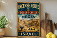 a vintage-style sign advertising the "Incense Route to Desert Cities in the Negov" in Israel.