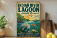 A vintage-style sign for the Indian River Lagoon in Florida, featuring illustrations of manatees, sea turtles, and a sunset over the lagoon.
