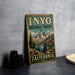 A vintage-style sign for Inyo National Forest in California, featuring a scenic mountain landscape with pine trees and a lake.