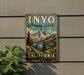 A vintage-style metal sign for Inyo National Forest in California, featuring a scenic mountain landscape with pine trees and a lake.