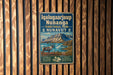 A vintage metal sign for Iqalugaaajup Nunanga Territorial Park, featuring an illustration of a reindeer and a mountainous landscape.