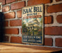 A vintage-style sign for Isaac Bell House in Newport, Rhode Island, featuring an illustration of the house and the text "Step back in time" and "Experience architecture".