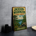 A vintage-style metal sign for Jackson-Washington State Forest, Indiana, featuring a scenic landscape with a river and trees.