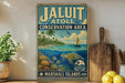 A vintage metal sign for the Jaluit Conservation Area in the Marshall Islands, featuring a tropical island scene with a sailboat, palm trees, and a turtle swimming in the ocean.