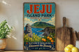 A vintage-style sign for Jeju Island Park, the Republic of Korea, featuring a scenic landscape with mountains, a statue, and a body of water.
