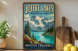 A vintage-style sign for Joffre Lakes Provincial Park in British Columbia, Canada, featuring a scenic mountain landscape with a lake and pine trees.