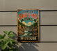 A vintage-style metal sign for Johnson's Shut-Ins State Park in Missouri, featuring a scenic landscape with a river and mountains.