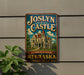 A vintage-style sign for Joslyn Castle, a landmark in Nebraska, featuring an illustration of the castle and the text "A Landmark of History Nebraska".
