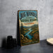 A vintage-style sign for the Jug Handle State Natural Reserve in California, featuring a scenic landscape with a river and mountains.