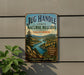 A vintage-style metal sign for the Jug Handle State Natural Reserve in California, featuring a scenic landscape with a river and mountains.
