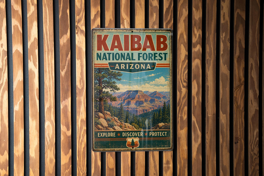 A vintage metal sign for the Kaibab National Forest in Arizona, featuring a scenic mountain landscape.