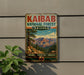 a vintage metal sign for the Kaibab National Forest in Arizona, with a mountain landscape and trees in the background.