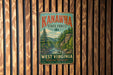 A vintage metal sign for Kanawha State Forest in West Virginia, featuring a scenic illustration of a forest landscape with a river and mountains.