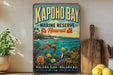 A vintage-style metal sign for the Kapoho Bay Marine Reserve in Hawaii, featuring a turtle swimming among colorful coral and fish.