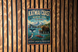 A vintage metal sign for the Katmai Coast Marine Zone in Alaska, featuring an illustration of wildlife and natural scenery.