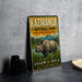 A vintage-style metal sign for Kaziranga National Park, India, featuring an illustration of a rhinoceros in a grassy landscape.
